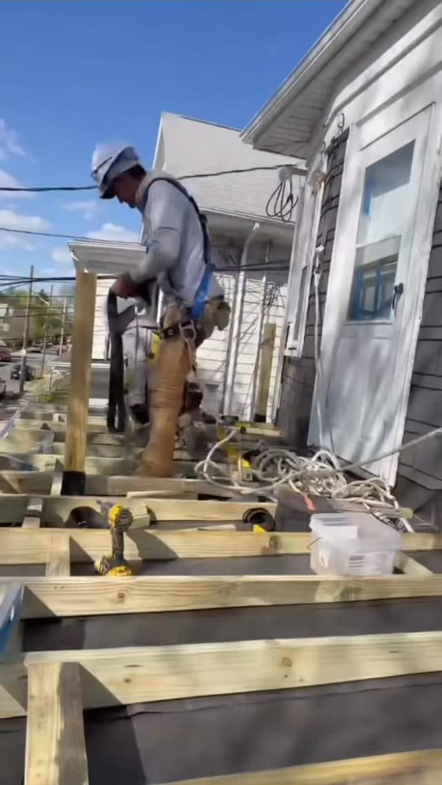Ede Feliciano working on a deck frame