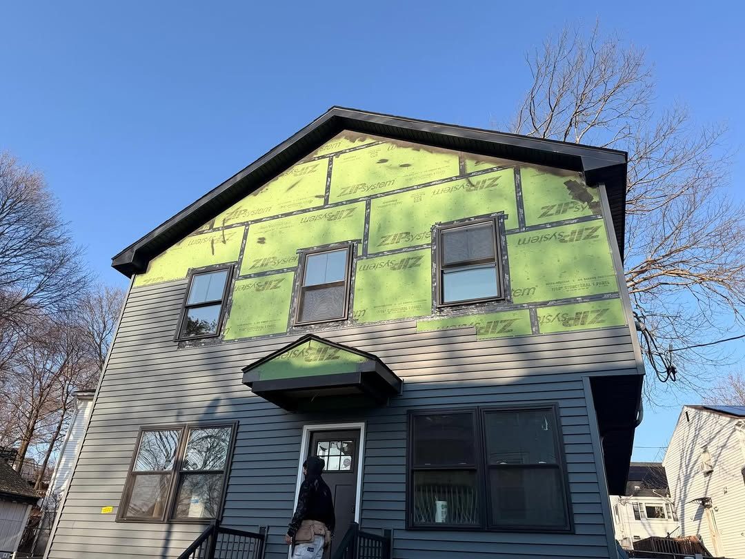House exterior during siding work